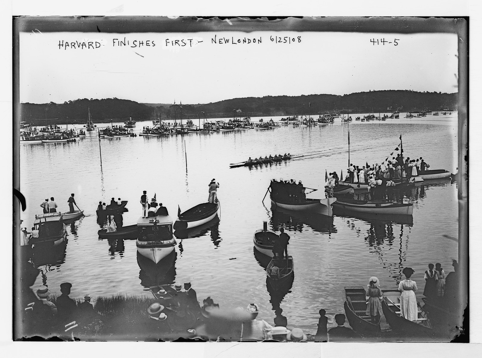 Freshman crew race, Harvard shell, winner, with spectators (Harvard-Yale), New London, Conn., 6/25/08. — historic photograph