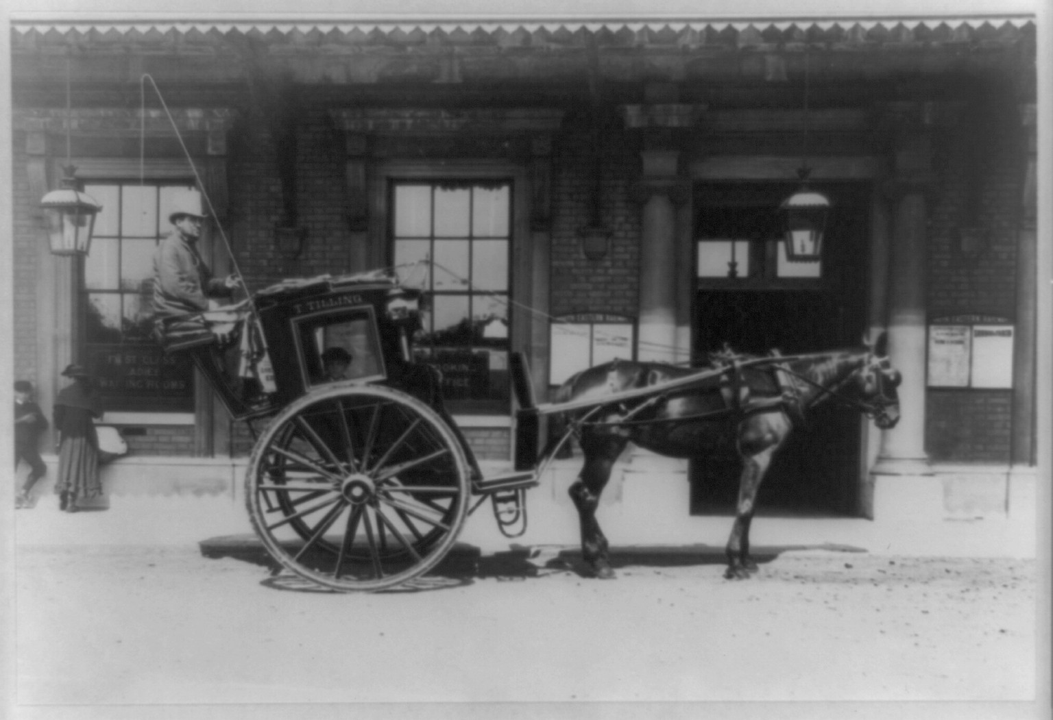 [Horse-drawn cab of T. Tilling, with boy inside and driver, London], 1884(?) — historic photograph