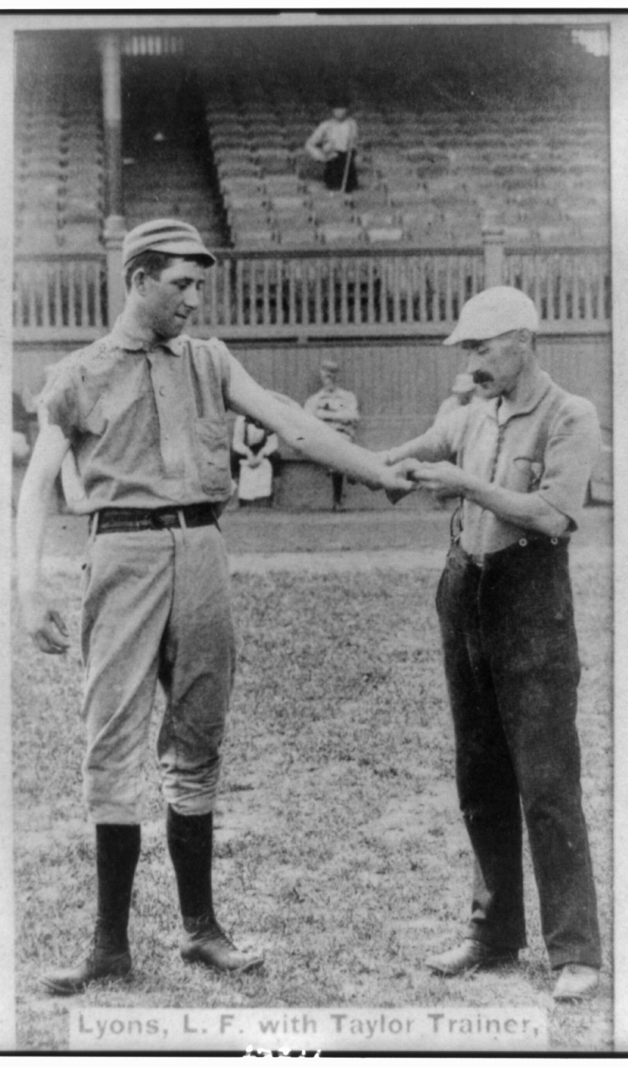 Lyons, l.f. [i.e., Jim Devlin, pitcher], with Taylor, trainer, Philadelphia, c1887. — historic photograph