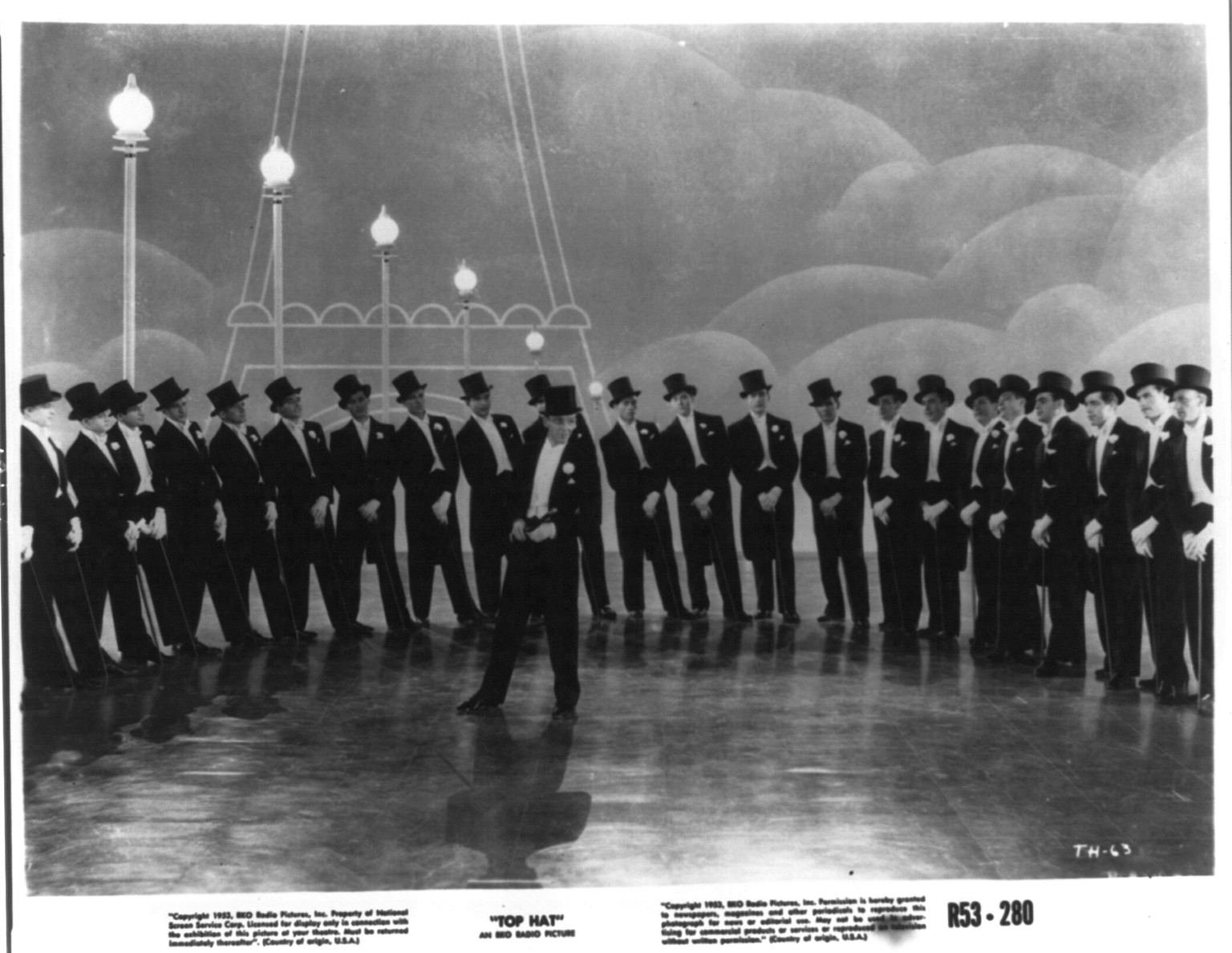 [Scene from Top Hat"; Fred Astaire dancing with large group of men]", 1953 — historic print