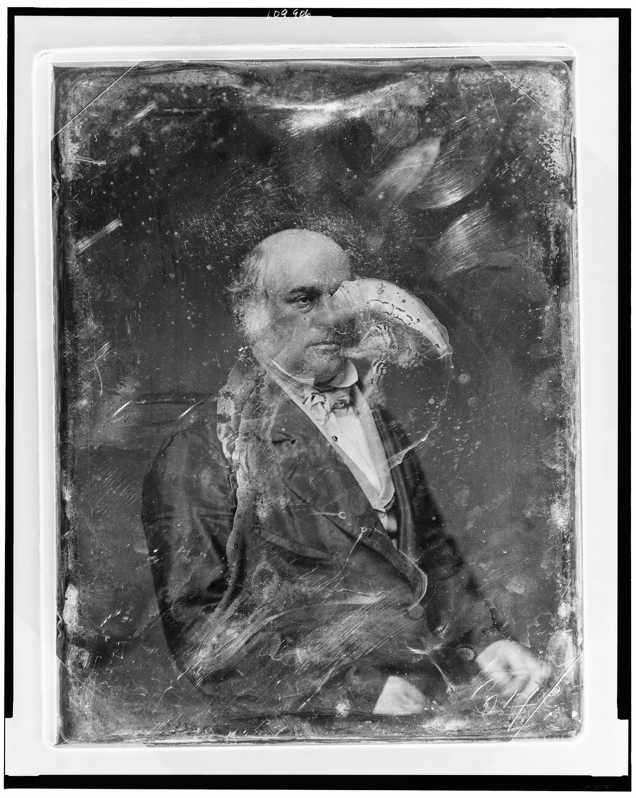 Unidentified seated bald man, daguerreotype portrait, 1844 — historic photograph