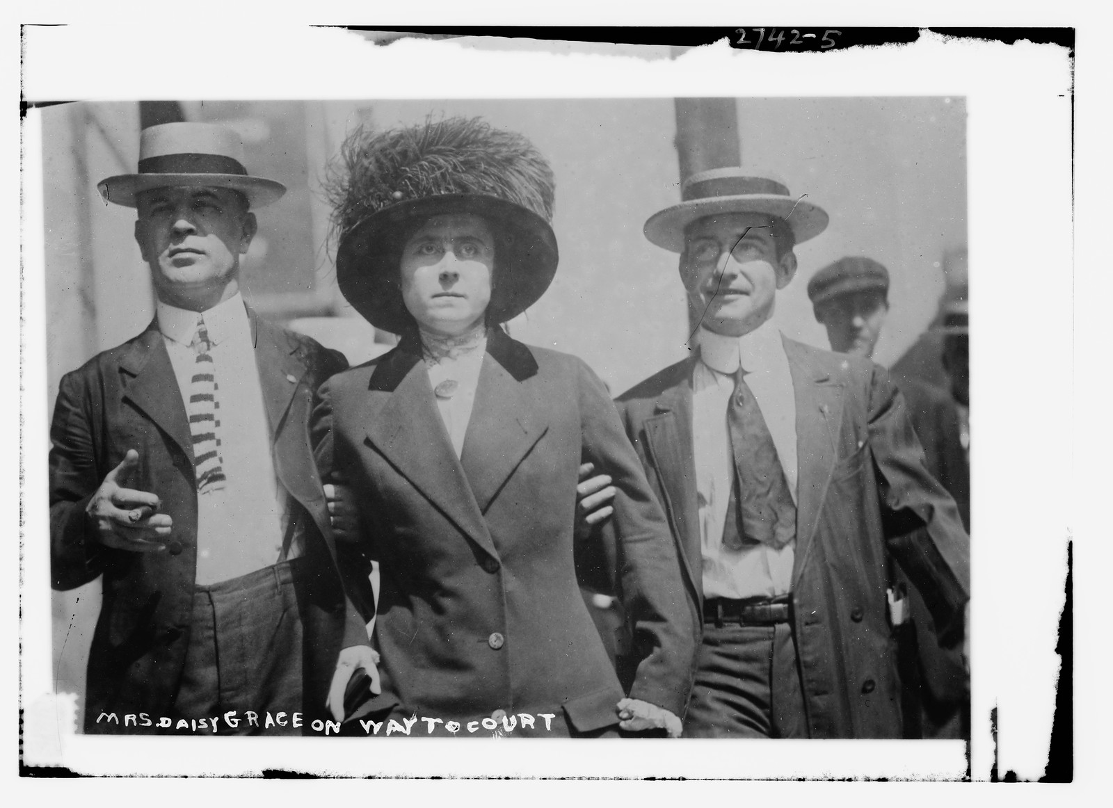 Mrs. Daisy Grace on way to court, n/a — historic photograph