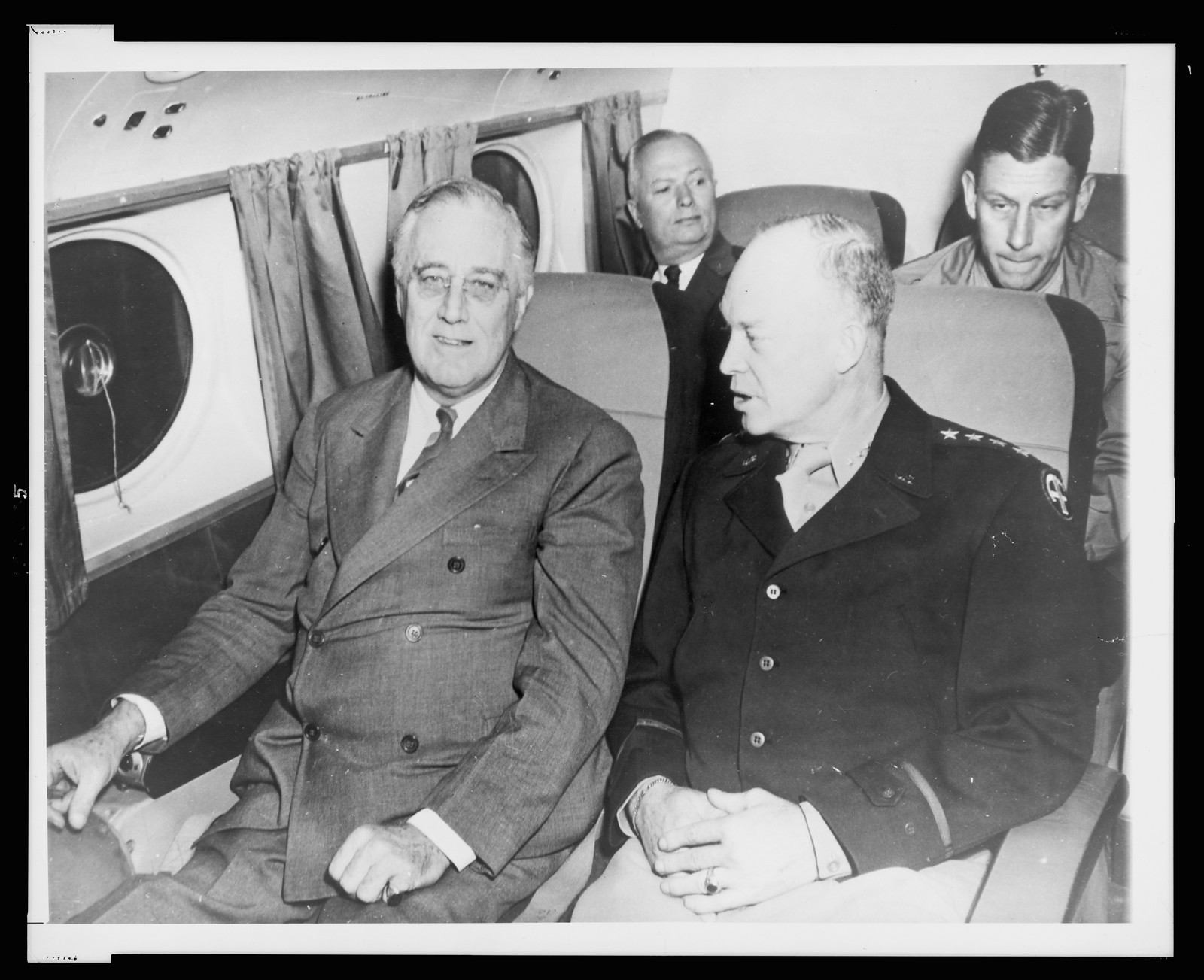 Roosevelt, Eisenhower chat in plane — historic photograph