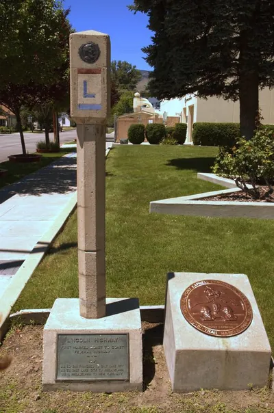 Lincoln Highway concrete marker with bronze Pony Express medallion