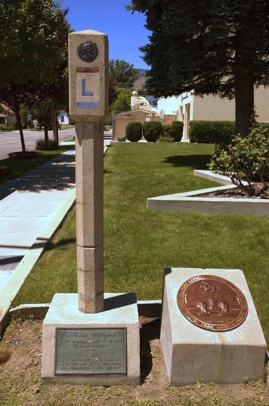 Lincoln Highway concrete marker with bronze Pony Express medallion — historic image