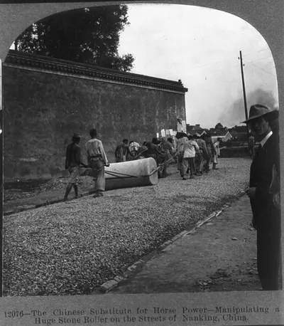 The Chinese Substitute for Horse Power - Manipulating a Huge Stone Roller on the Streets of Nanking, China