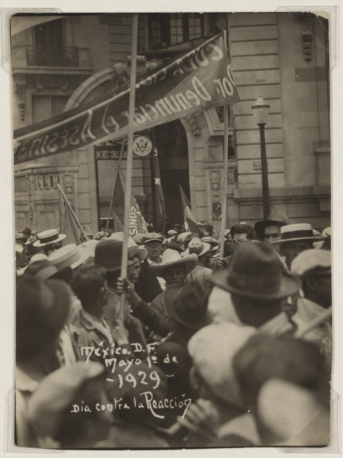 May Day 1929 march in Mexico City, banner and crowd — historic image