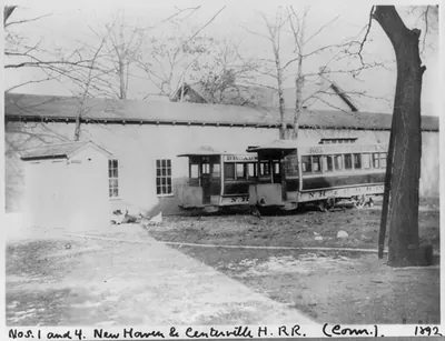 [Conn. - New Haven - horse-drawn street railway cars of New Haven & Centerville H.R.R.: cars nos. 1 & 4 beside car barn]