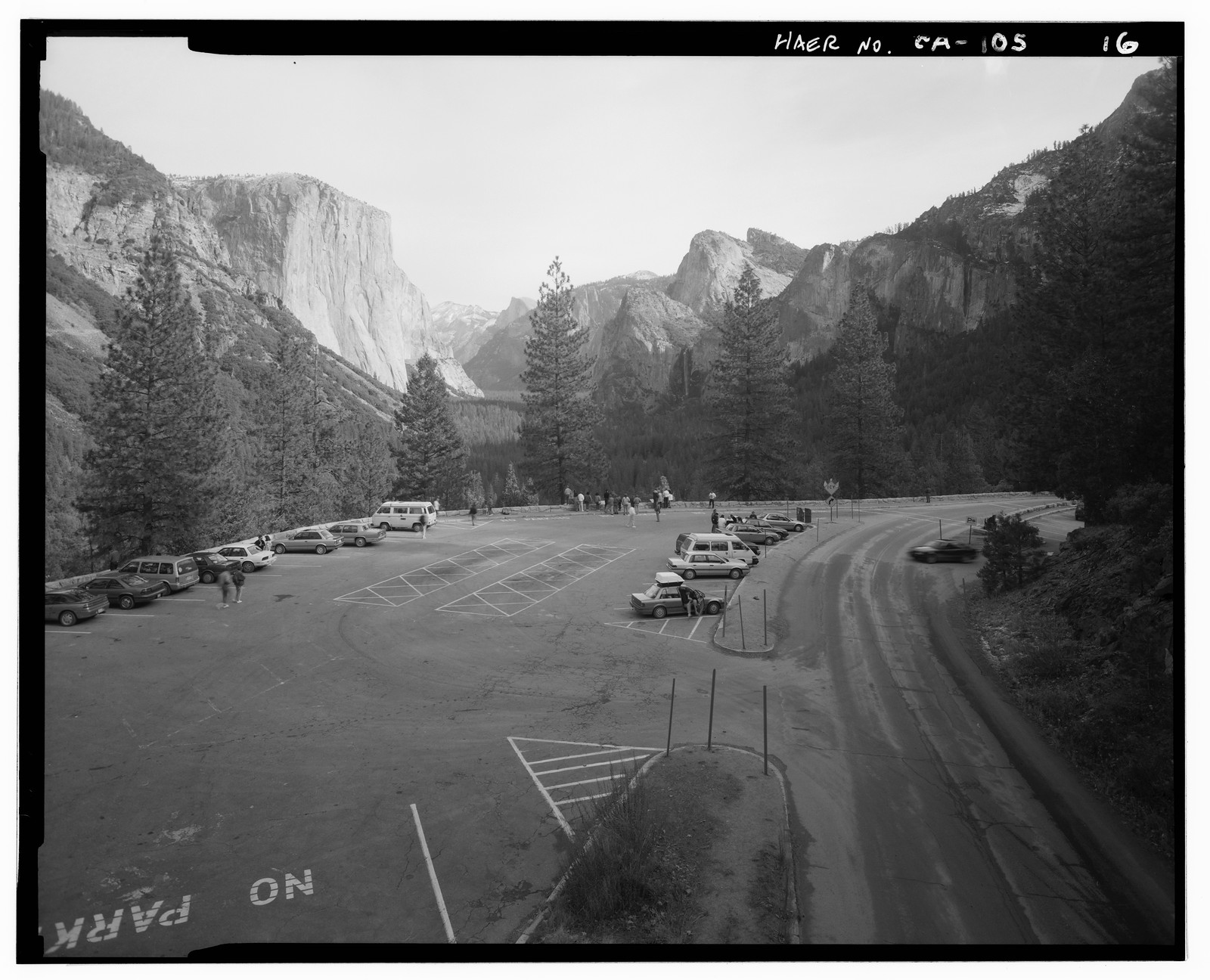 Yosemite Valley parking lot below granite cliffs — historic image