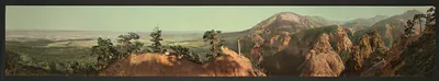Panoramic view of red rock ridges and valley
