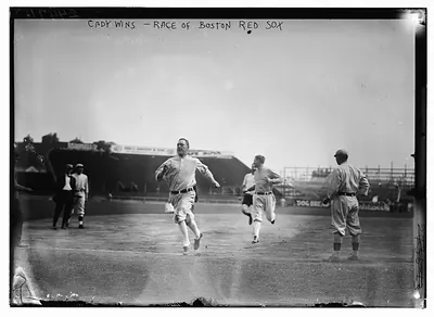 Hick Cady of Boston Red Sox wins foot race with Jack O'Brien (Boston Red Sox trainer, pin shorts, partially obscured) and teammate Buck O'Brien (looking to his right) at Fenway Park, Boston (baseball)