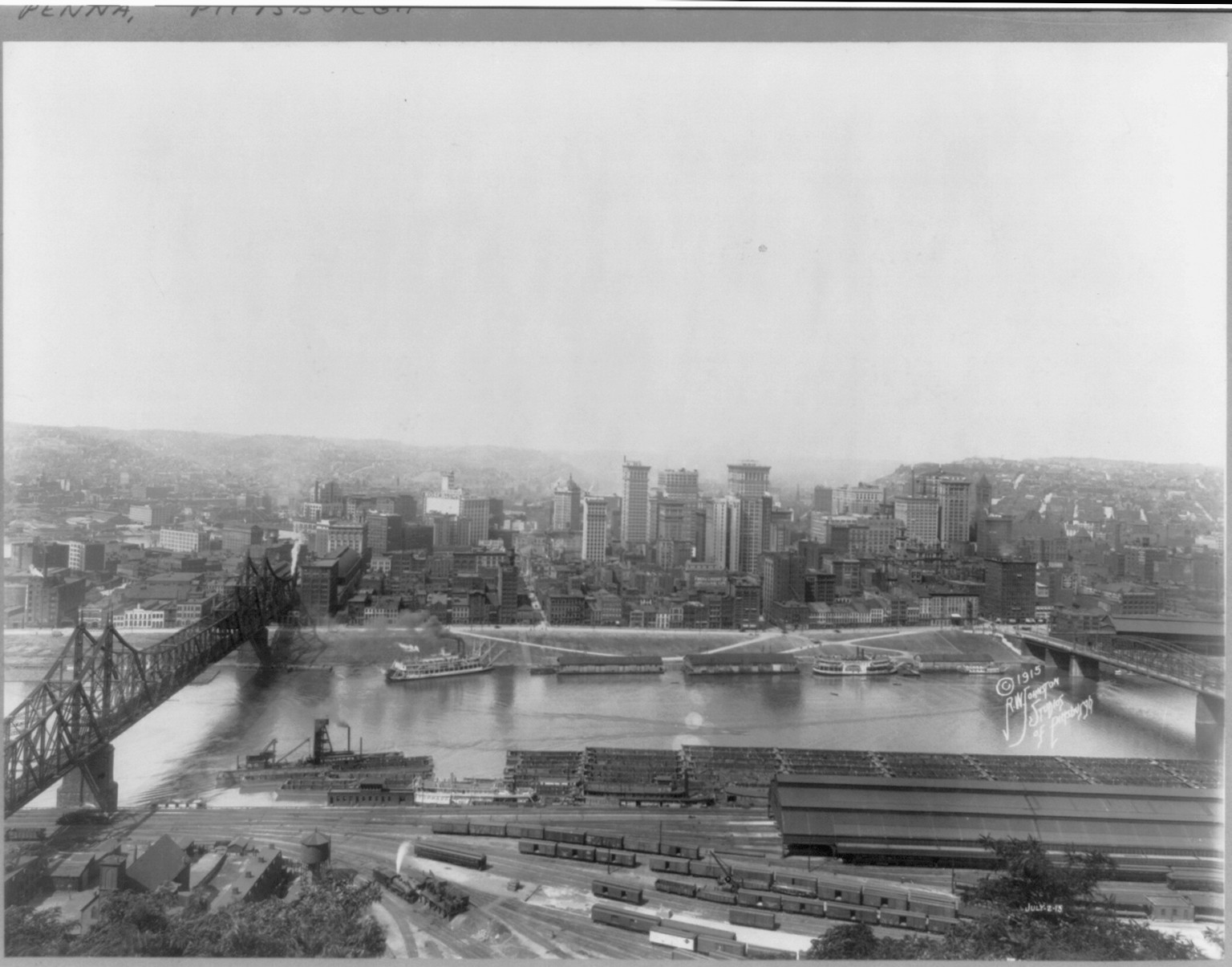 Pa. - Pittsburgh - panoramic view; rail yards and coal barges in foreground. July 2, 1915 — historic photograph