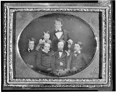 [William Cassiday Cattell, holding large Bible, with five page boys]