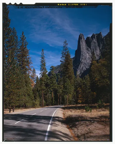 Two-lane road past granite spires and pines, Yosemite