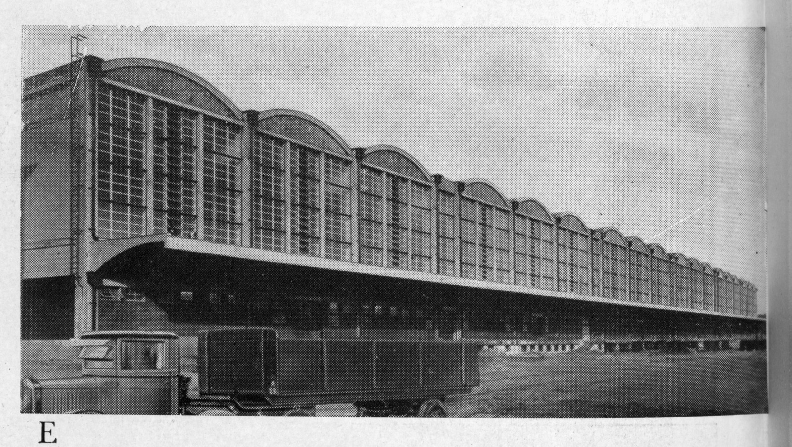 Long glazed hall with arched bays and a lorry — historic image