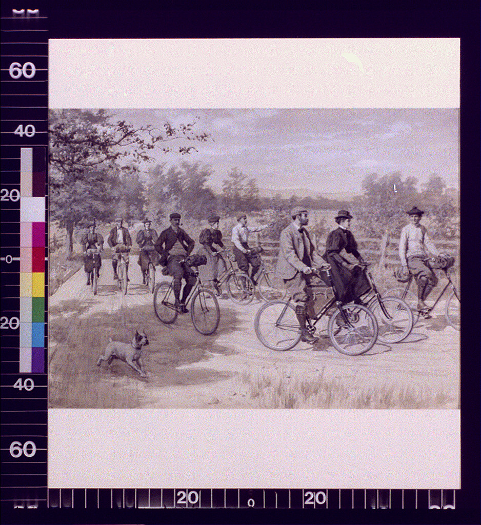Cyclists riding along a country road with a dog — historic image