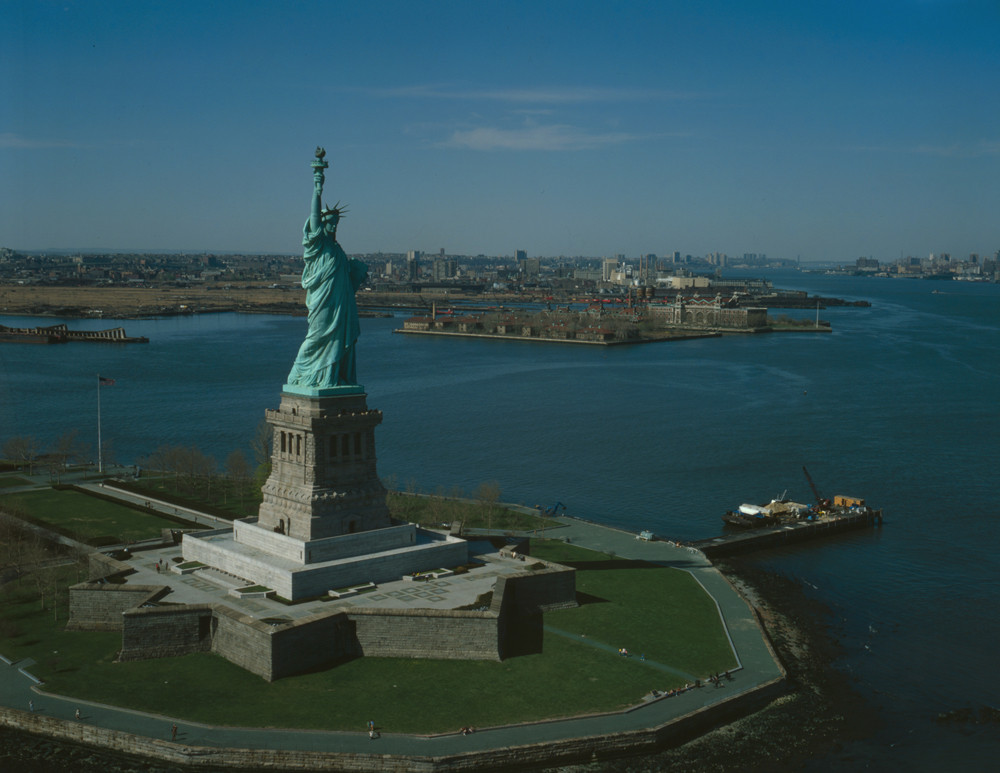 Aerial view of the Statue of Liberty and harbor — historic image