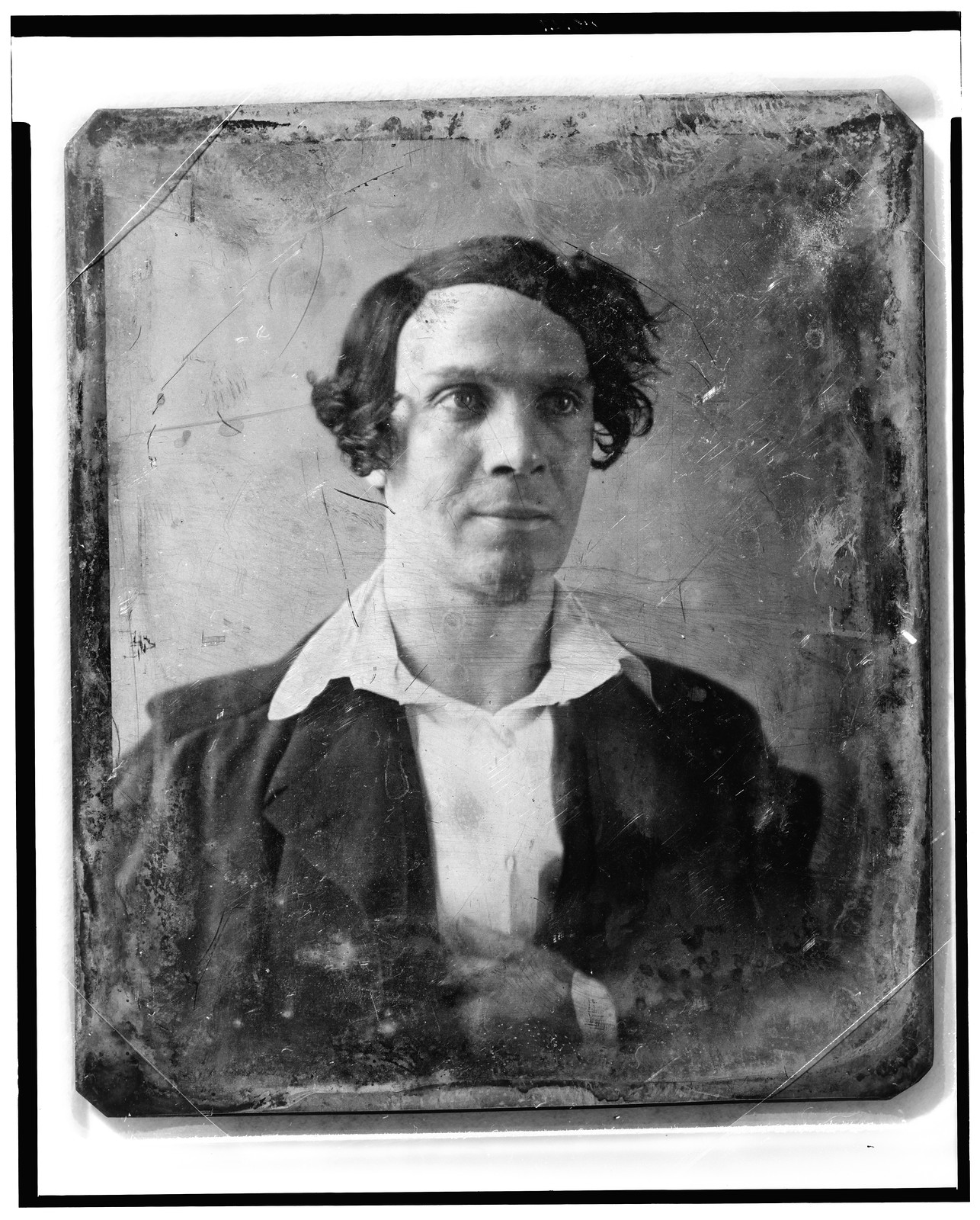 Daguerreotype portrait of a man with wavy hair, 1844 — historic photograph