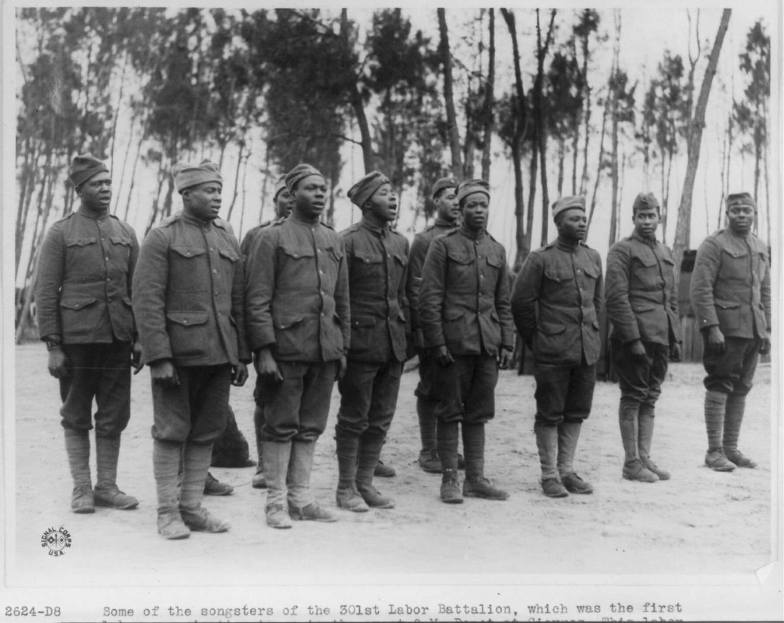 Some of the songsters of the 301st Labor Battalion, which was the first labor organization to go to the great Q.M. Depot at Gievres, France, 1918 Dec. 3. — historic photograph