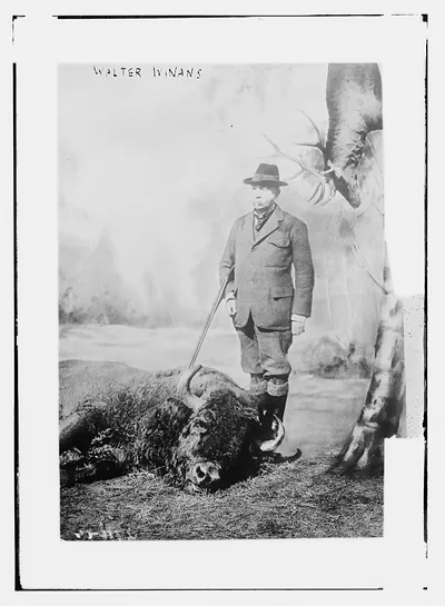 Walter Winans with gun and dead buffalo