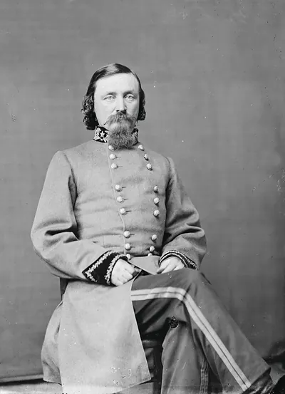 Seated Confederate officer in gray uniform, studio portrait