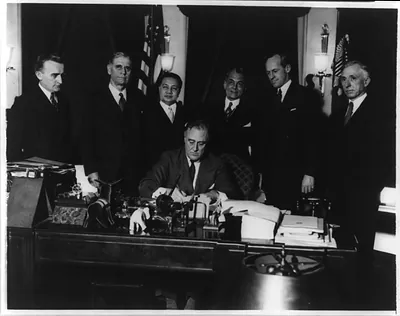 President Roosevelt signing the bill for Philippine independence