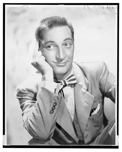 [Garry Moore, half-length portrait, seated with right elbow resting on knee, facing front]