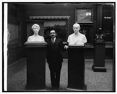 M.W. Dykaar with busts of Pres & Mrs. Coolidge at National Gallery, [Washington, D.C.]