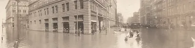Flooded city street with boats and wading people, Pittsburgh