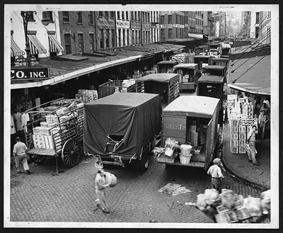 Long lines of trucks being loaded at a produce market