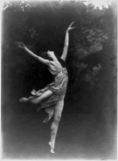 Lisa Duncan leaping on the grass