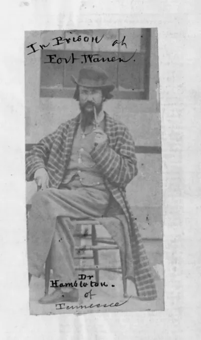 [Dr. Hambleton, full lgth, seated, facing slightly left, in prison at Fort Warren, Boston, Mass.]