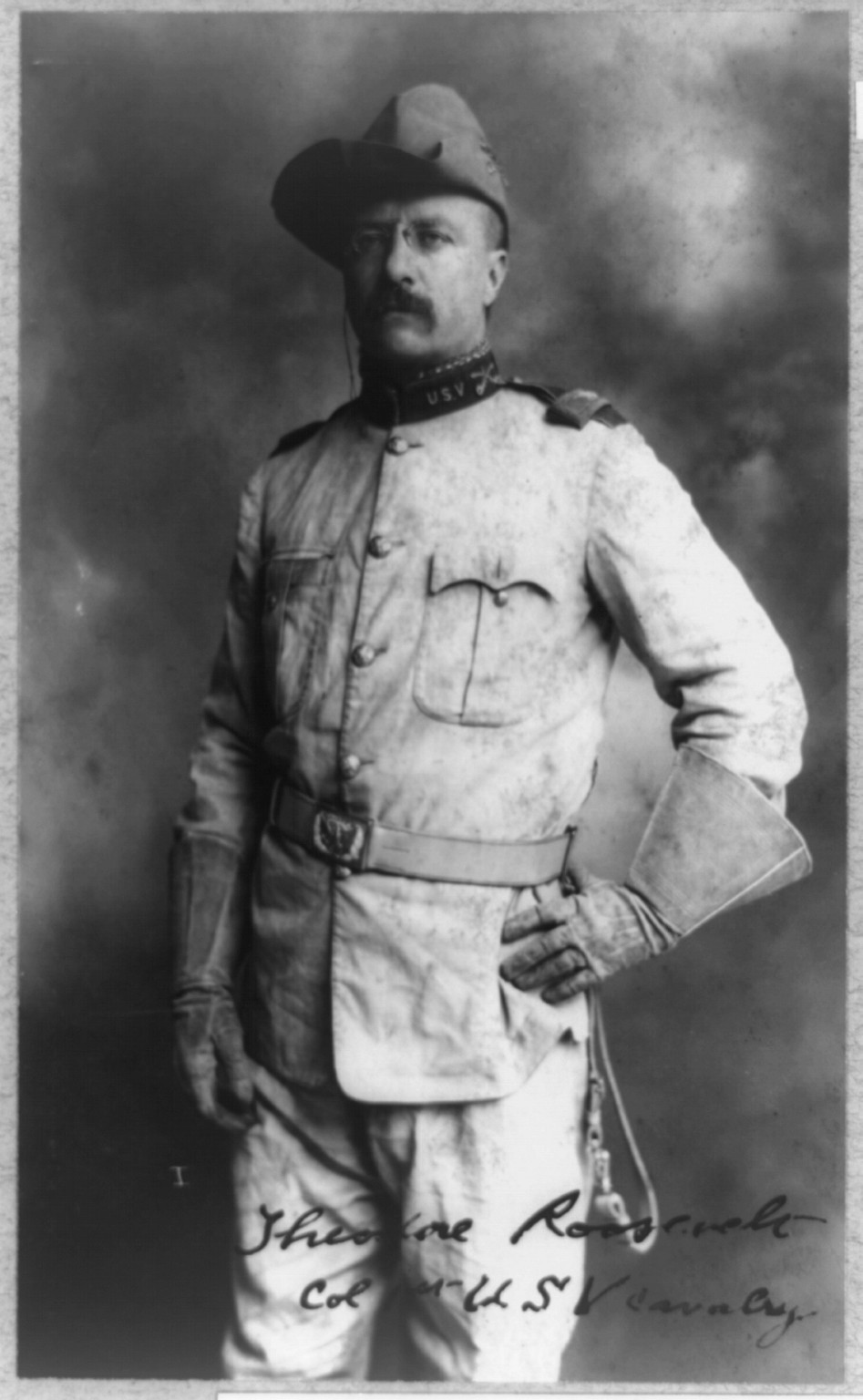[Theodore Roosevelt, three-quarter length portrait, standing, facing left, in uniform], 1898 — historic photograph