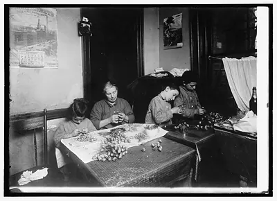 Making artificial flowers in a New York tenement house