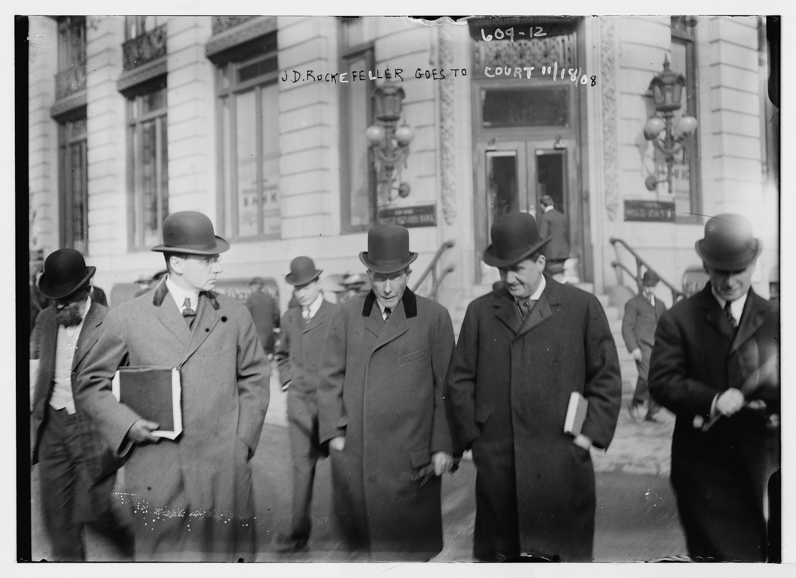 J.D. Rockefeller with others before court house , New York, n/a — historic photograph
