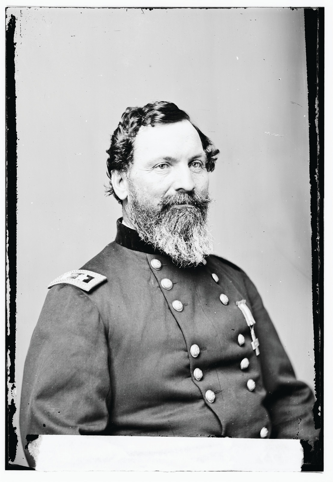 Bearded Union officer in dark uniform, studio portrait — historic image
