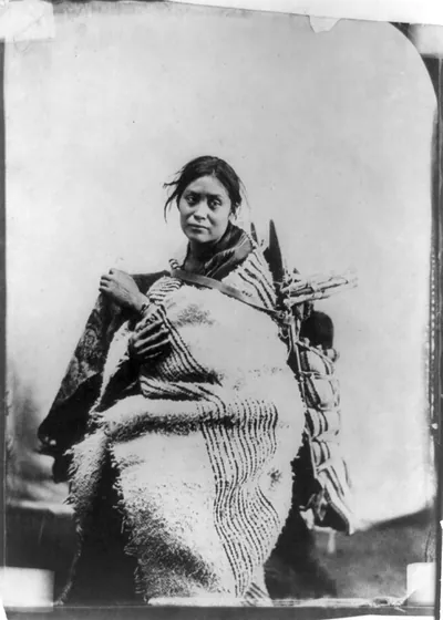 [A Navajo woman with infant on her back]