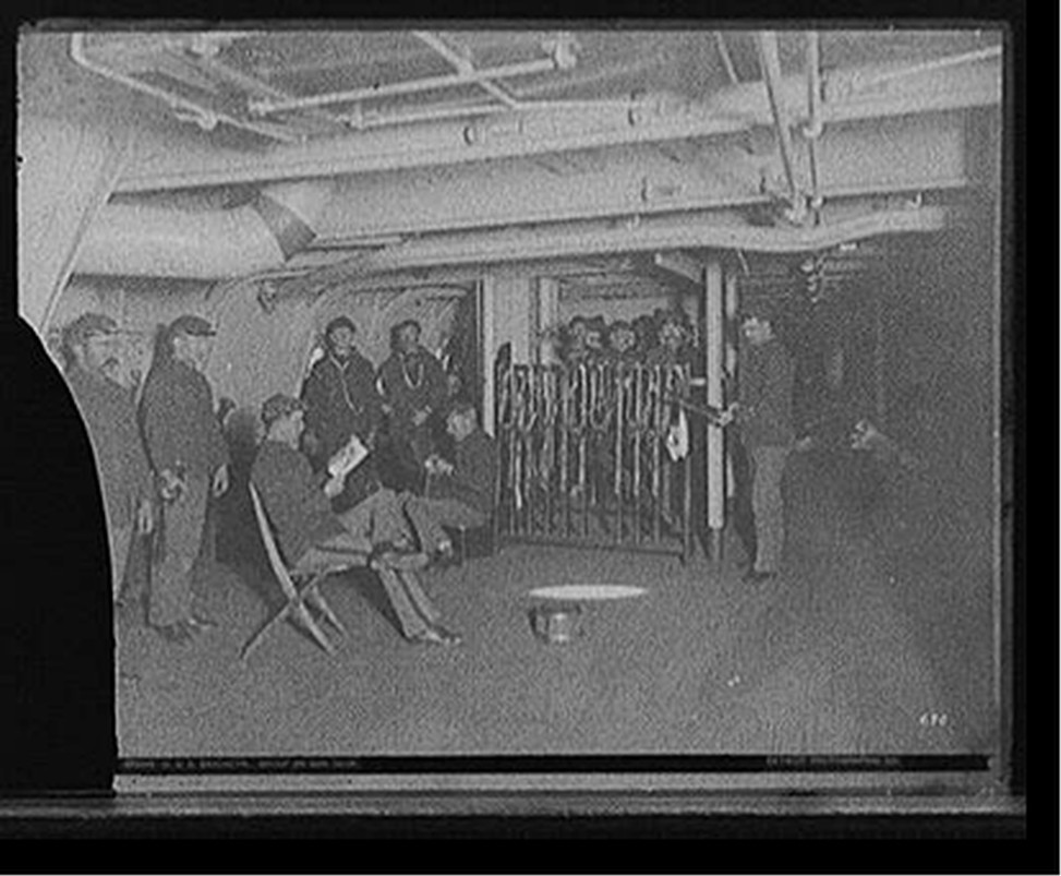U.S.S. Brooklyn, group on gun deck, [between 1896 and 1899] — historic photograph