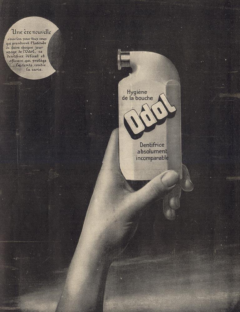 French advertisement for Odol toothpaste held in hand — historic image