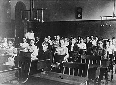 [Boys and girls seated at desks in Washington, D.C. classroom]