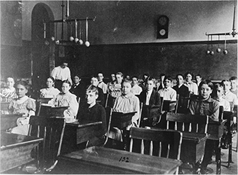 [Boys and girls seated at desks in Washington, D.C. classroom], [1899?] — historic photograph