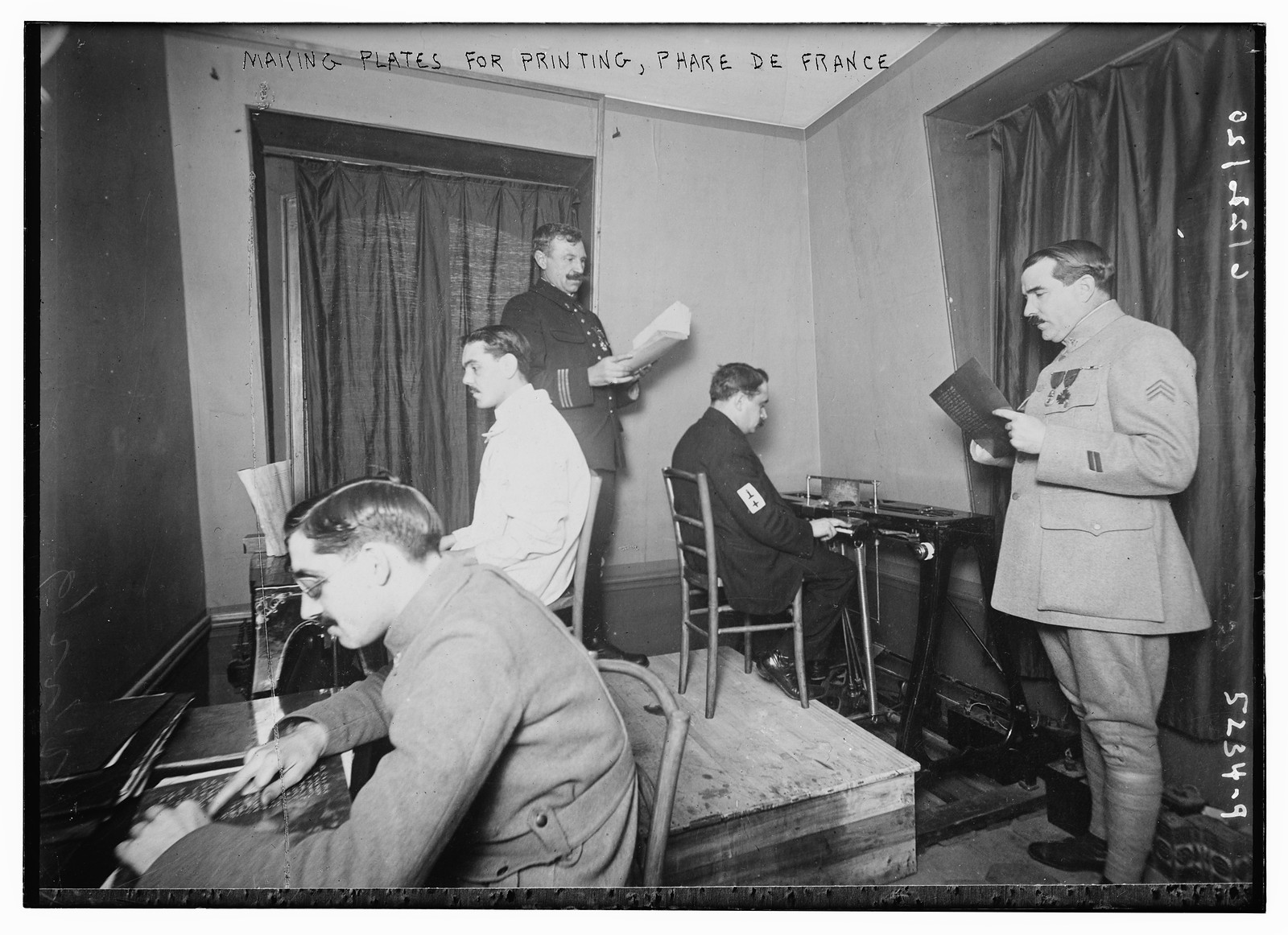 Making plates for printing, Phare de France, n/a — historic photograph