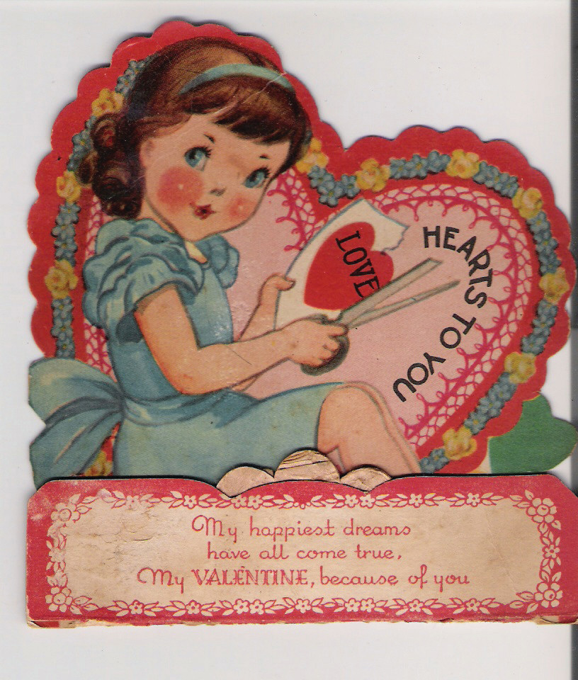 Die-cut valentine card of girl cutting a heart — historic image