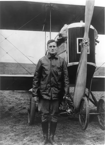 [Carl Spaatz, full-length portrait, standing in front of airplane, facing front]