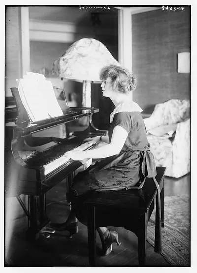 Larrmore (seated at piano)