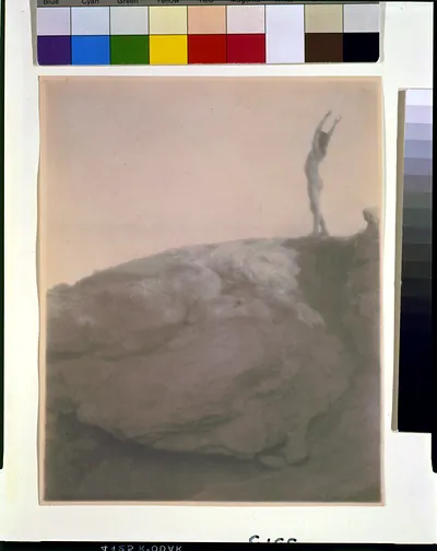 [Nude boy in rocky landscape, arms raised]