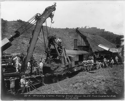 Wrecking cranes freeing steam shovel no. 231 from Cucaracha slide [Panama Canal], 4 Oct. 1909