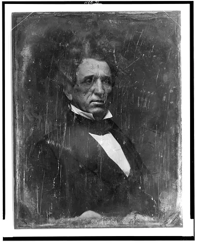 Daguerreotype portrait of a man in dark coat and white collar