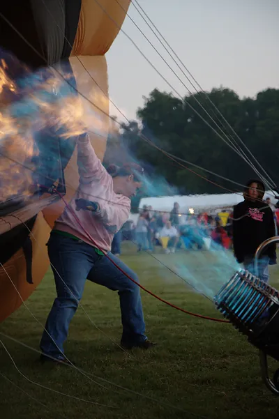 Hot air balloon being inflated with burner flame