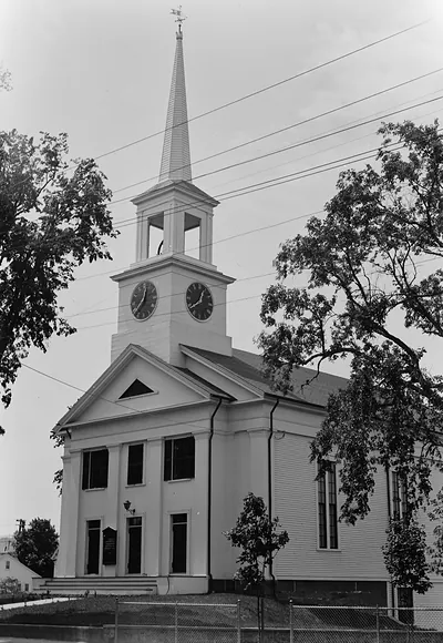 White church with clock tower and tall steeple